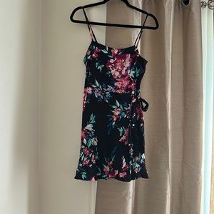 Floral navy blue dress straps,ruffles along the skirt on the left side and below